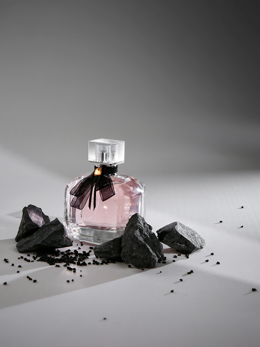 light pink perfume bottle with black rebon